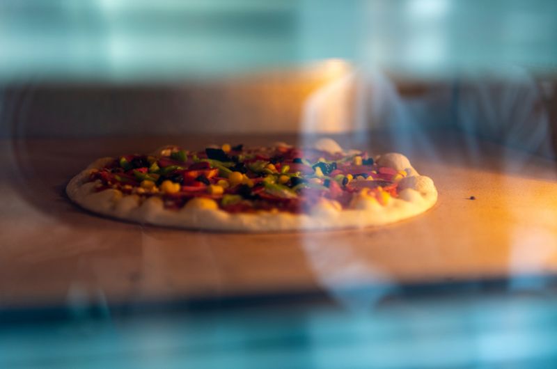 Delicious pizza sizzling in the oven