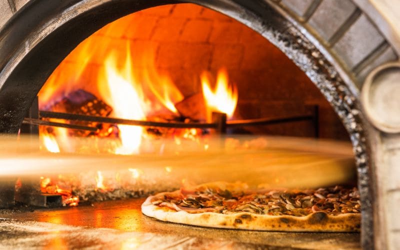 https://pizzello.com/cdn/shop/articles/wood_fired_pizza_oven.jpg?v=1711334855