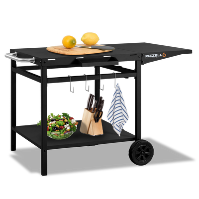 Black grill cart with a salad bowl, knife block, towel, and lemons. Top features Pizza Oven & Cart logo and pizza peel. Mobile on wheels. Available at Walmart.