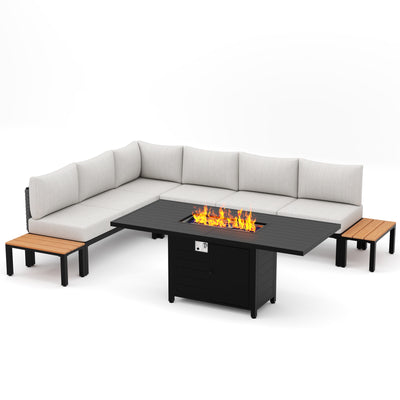 Modern L-shaped outdoor sofa, two wood side tables, and a black fire pit table with visible flames in the center.