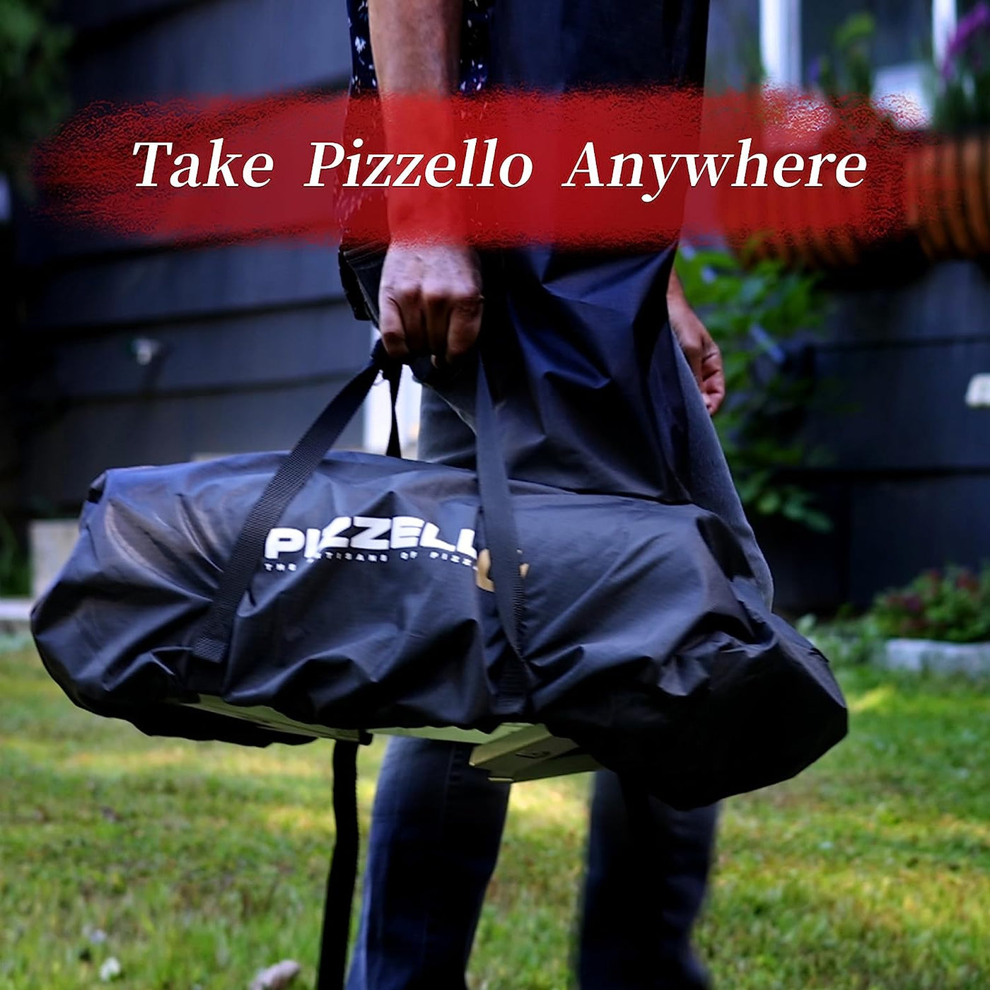 A person carries a black Pizzello bag across the grass, promoting the portable Pizzello Forte Outdoor Gas Pizza Oven for on-the-go use.