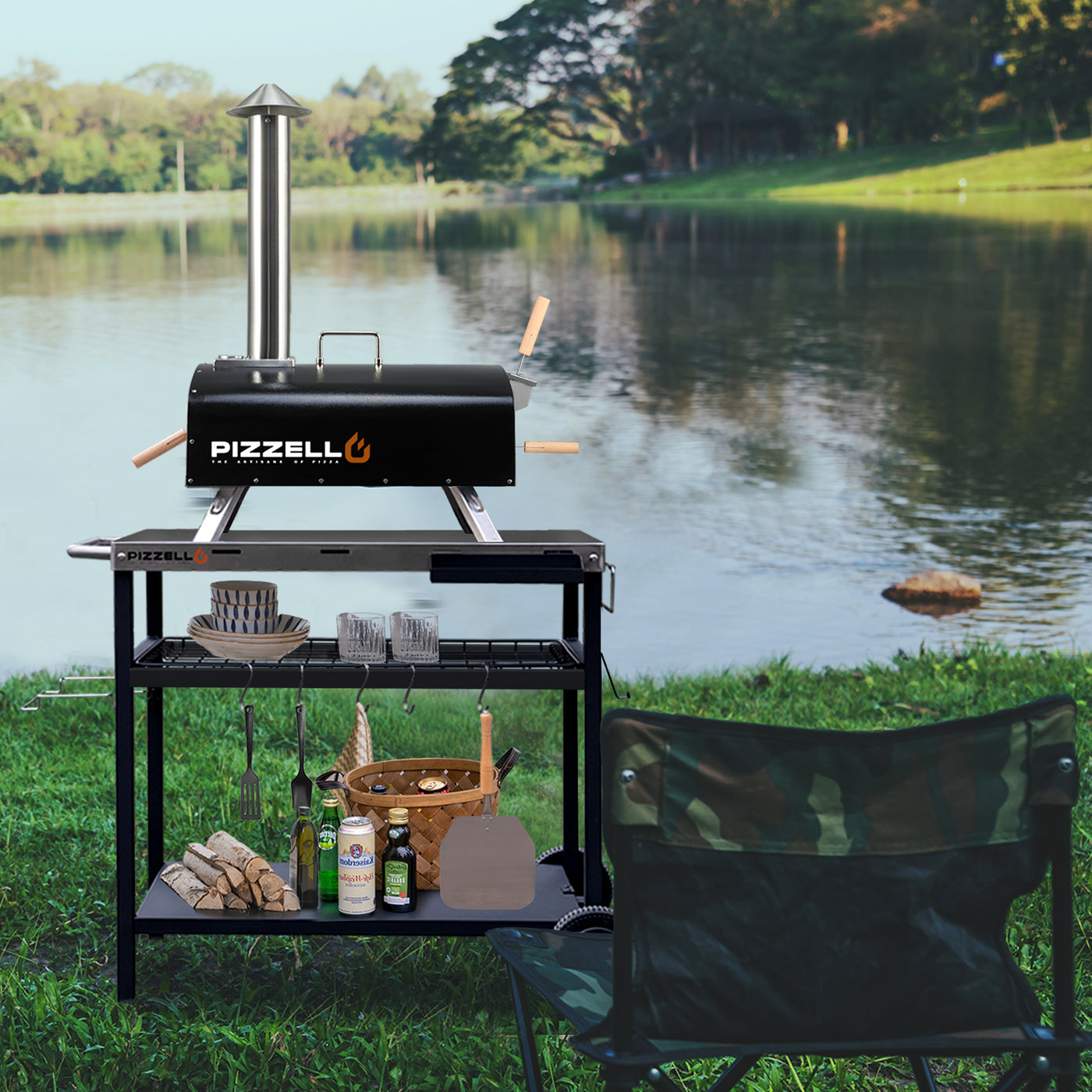 Outdoor Pizzello Forte - Outdoor Wood Fired Pizza Oven by a lakeside with a stainless steel pizza peel, and ingredients on a clear day.